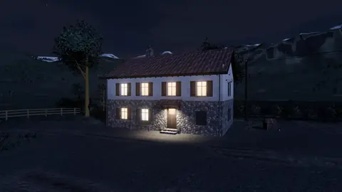 Gece pencereleri aydınlanmış çiftlik evi